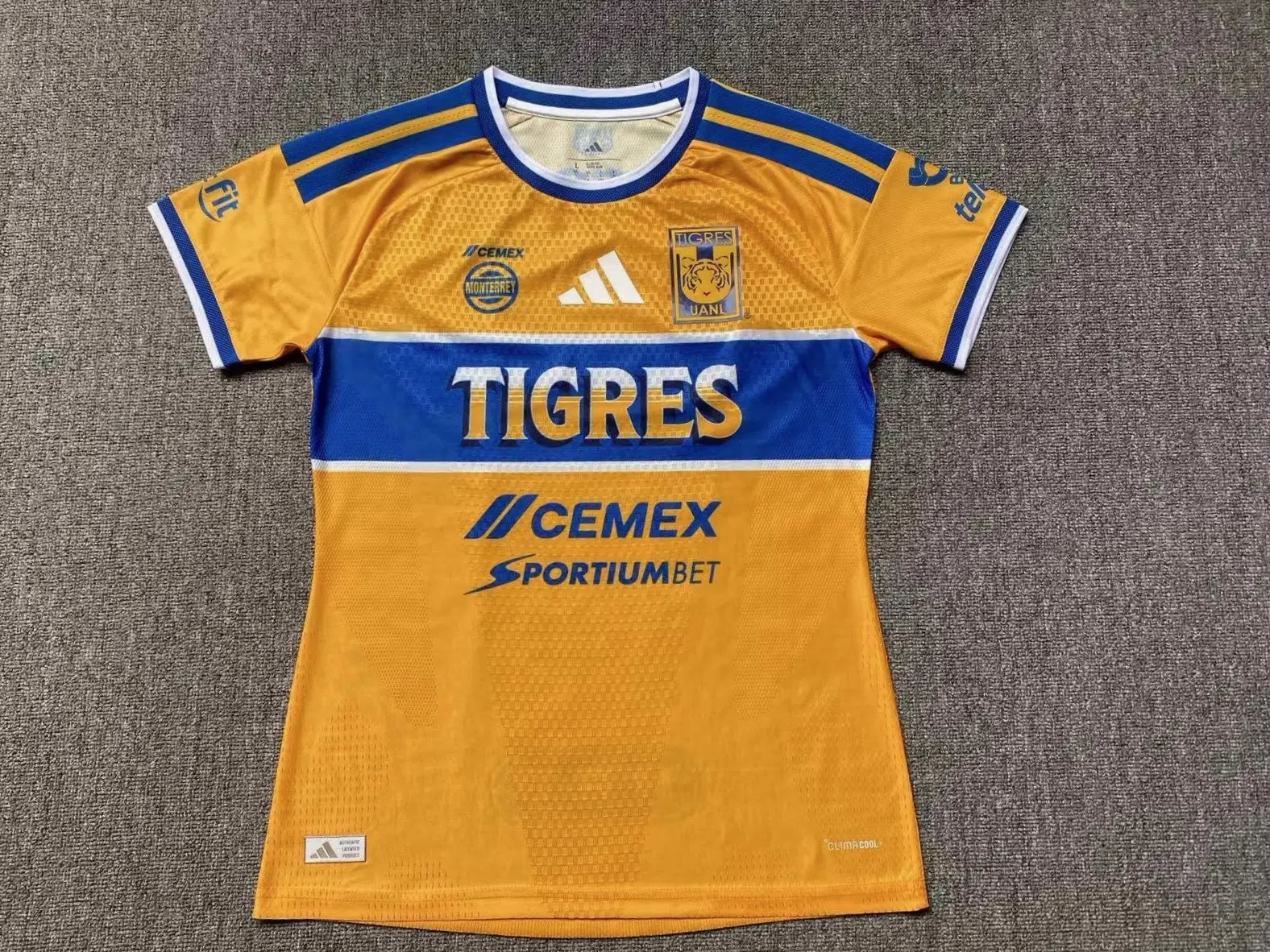 Mujer a Tigres Amarillo Local 26‑27